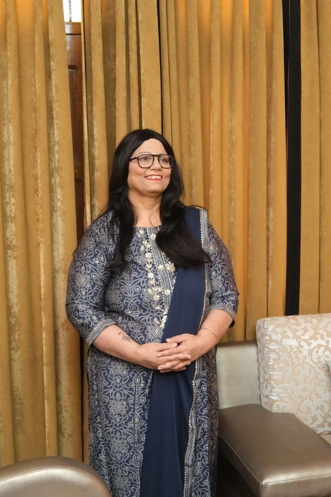 Sarita Chugh smiling warmly as a parenting coach